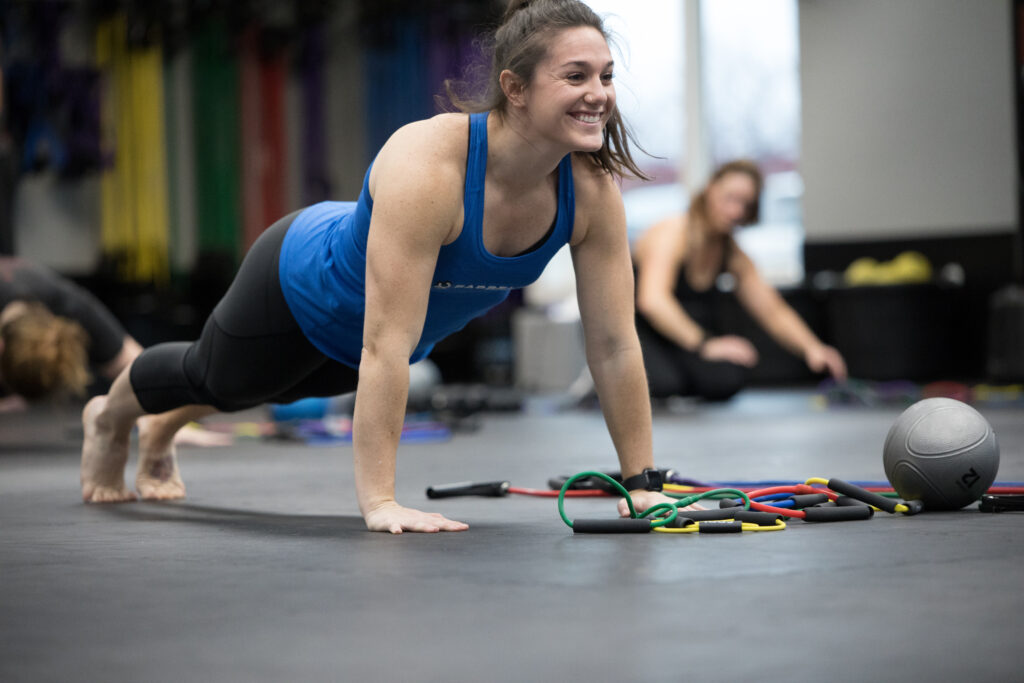 woman doing push-ups strength training
